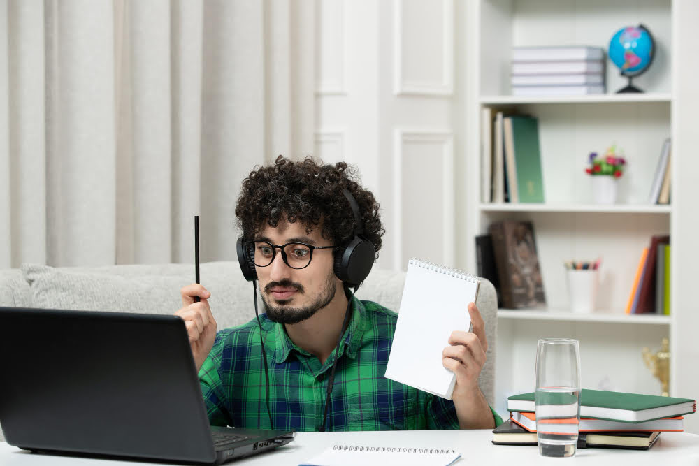 online young guy studying Online PhD Courses